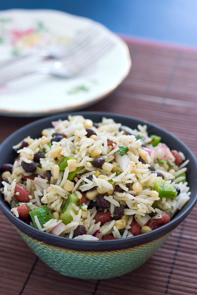 Beans and Rice Salad

A great summer twist on the classic rice and beans. Chock full of yummy veggies, this salad could easily take the place of an entree.
