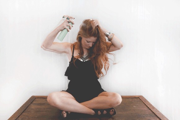 Spray the roots of your hair with dry shampoo before bed to wake up with clean looking hair