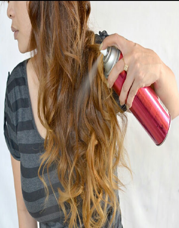 After Going all around your hair, set your beach waves with hairspray.