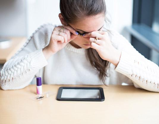 20. Lay a handheld mirror on a table, prop your elbows up, and lean directly over the mirror for a steady false lash application.