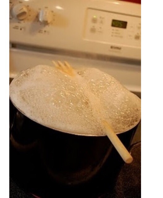Put wooden spoon over a boiling pot to prevent spill overs..
