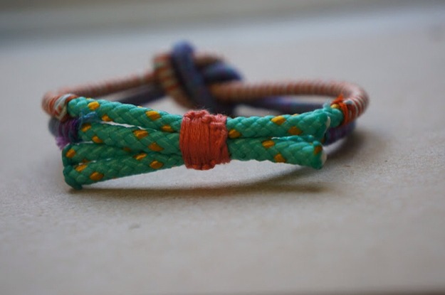 The Wrapped Cord Friendship Bracelet

Full instructions:
http://a-few-good-things.blogspot.com/2012/09/diy-wrapped-and-knotted-cord-bracelet.html?m=1