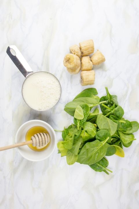 To make it, blend together:
	•	1 frozen banana
	•	1 cup greens (baby spinach, destemmed kale, collards, chard, etc.)
	•	1 cup unsweetened milk (nut, soy, animal)
	•	Honey or maple syrup, to taste