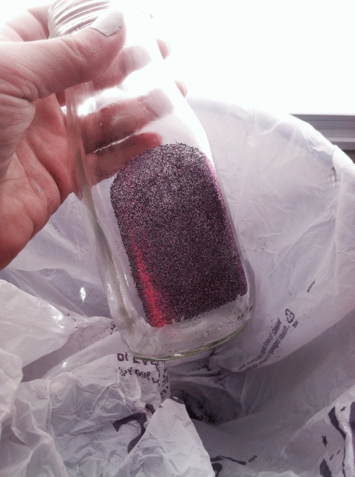 Step 5: Evenly disperse the glitter all around the sticky part of the bottle.