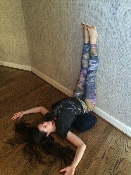 LEGS UP THE WALL
Use a bolster or pillows under the lumbar curve to release the low back, and try to let all your thoughts go during this relaxing and restorative pose.
