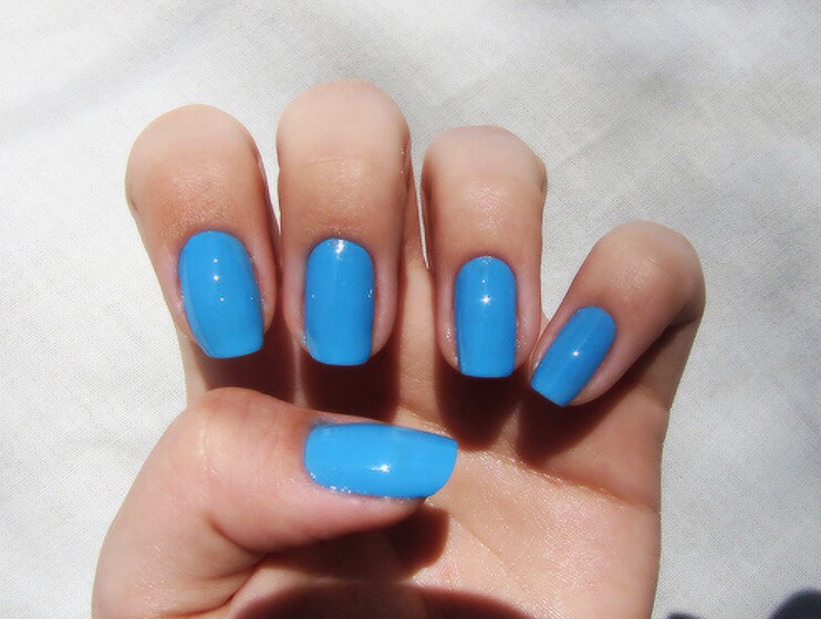 If you put Vaseline on your fingers around your nails while you are painting them, any excess polish will wipe right off once you are done.