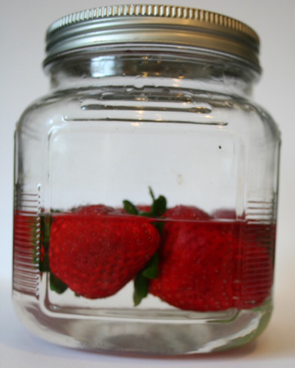 First, rinse your strawberries. Then place them in a jar. Pour in chocolate vodka until they are submerged. Seal and refrigerate for 24 hours. *Note – you really need to let them soak. I ate one after only 6 hours and your could note yet taste the vodka.