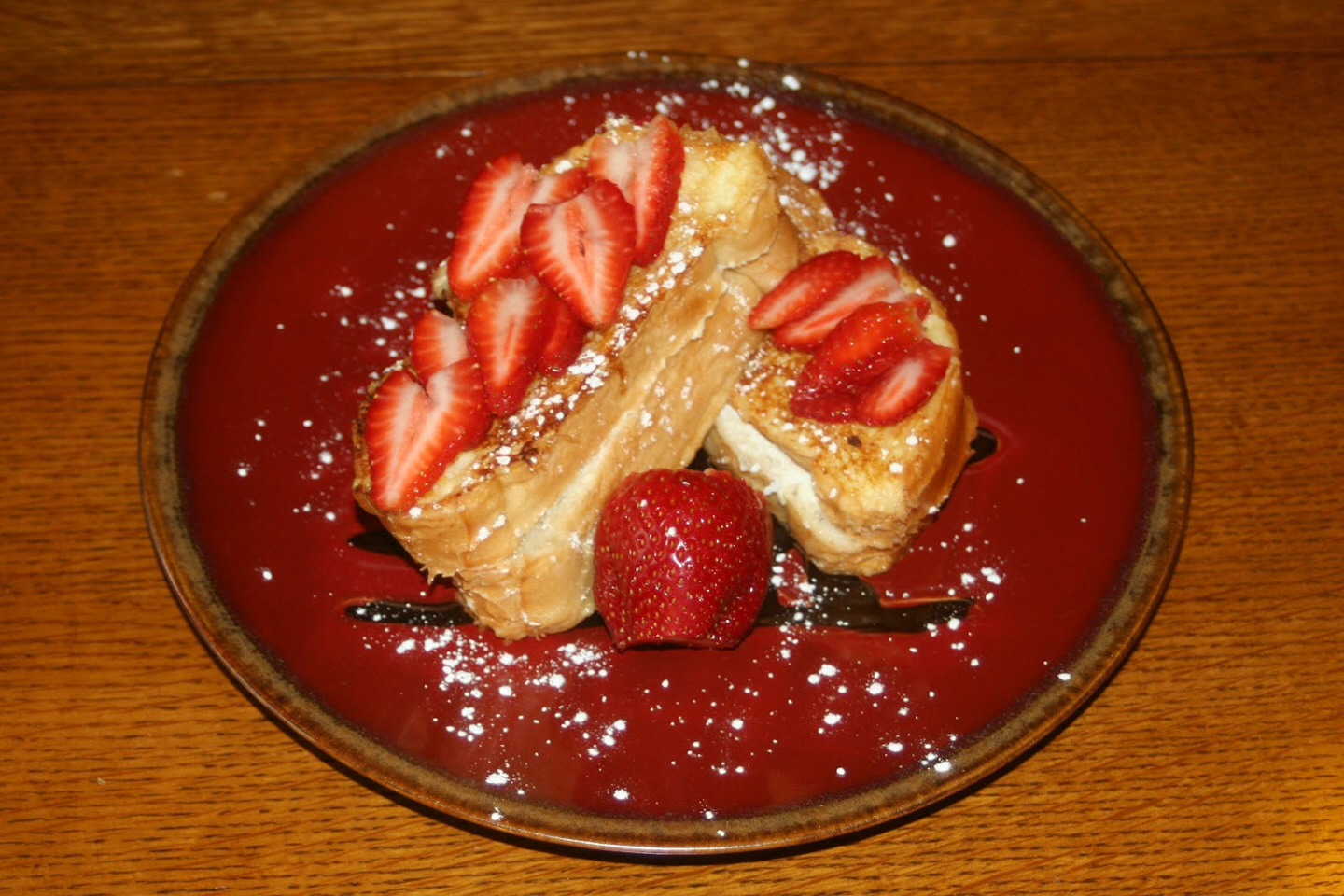 Take the strawberry jam and cream cheese blend well then spread on your bread take another piece of bread and put it on top like a sandwich then put it in French toast batter and then cook until bread becomes golden
