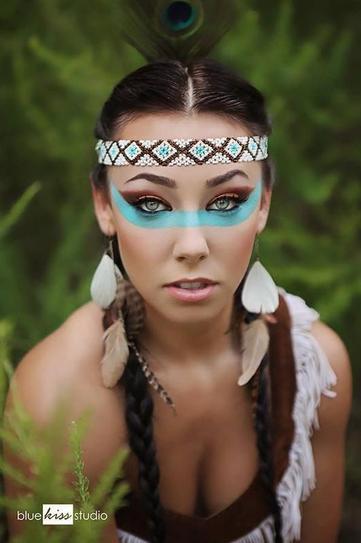 13.  Tribal-inspired look is also a great option for an ultimately cool Halloween makeup. Apply brown shadow on your eyes and create a thick line with a blue paint, stretching from right ear to the left. Middle-section your tresses and create two pigtail braids, wearing a cute headpiece on your fore