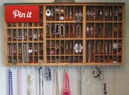 A large drawer organizer turned on its side has lots of slots to hold everything 